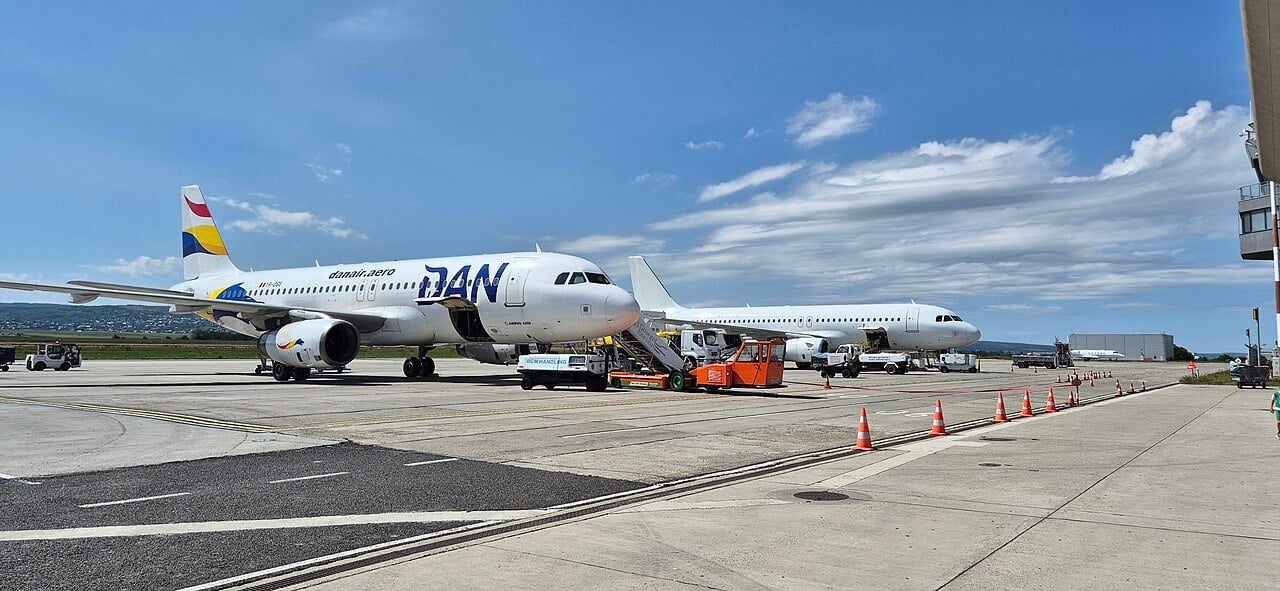 Two Dan Air Airbus A320s parked at Bacau airport in Romania