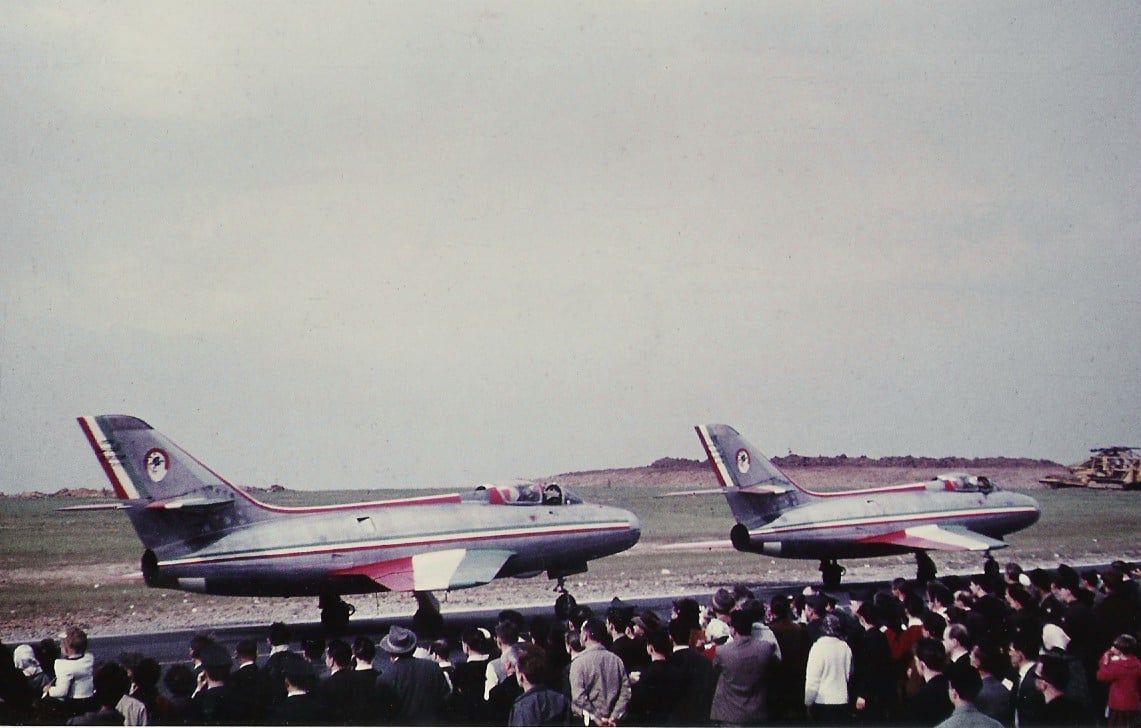 Two Patrouille de France Dassault Mystère IVA jets taxiing past spectators at Bitburg Air Base in the early 1960s