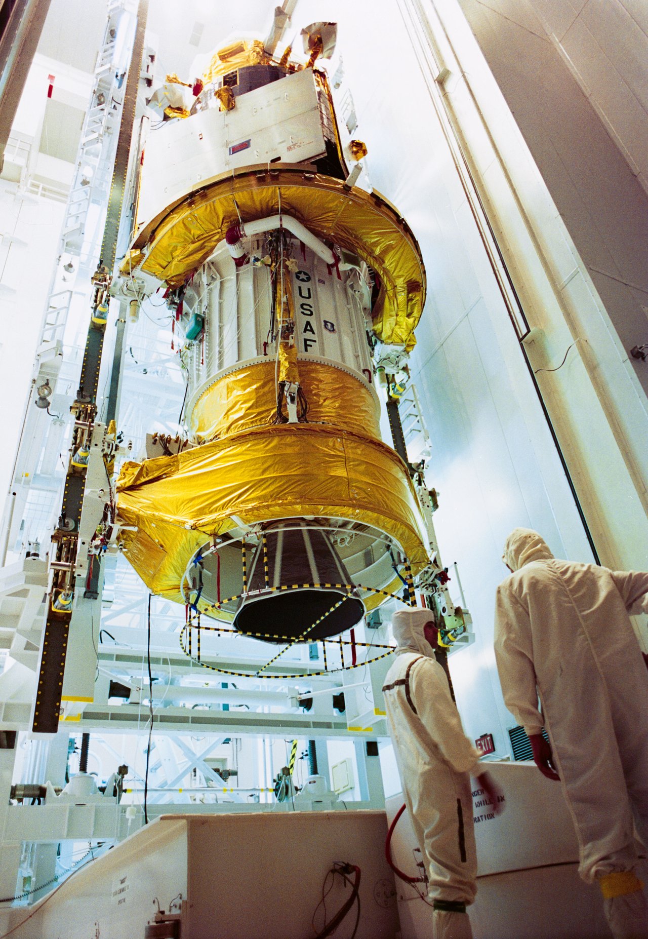 DSP missile-warning satellite stacked on its Inertial Upper Stage inside a Cape Canaveral processing facility in October 1991