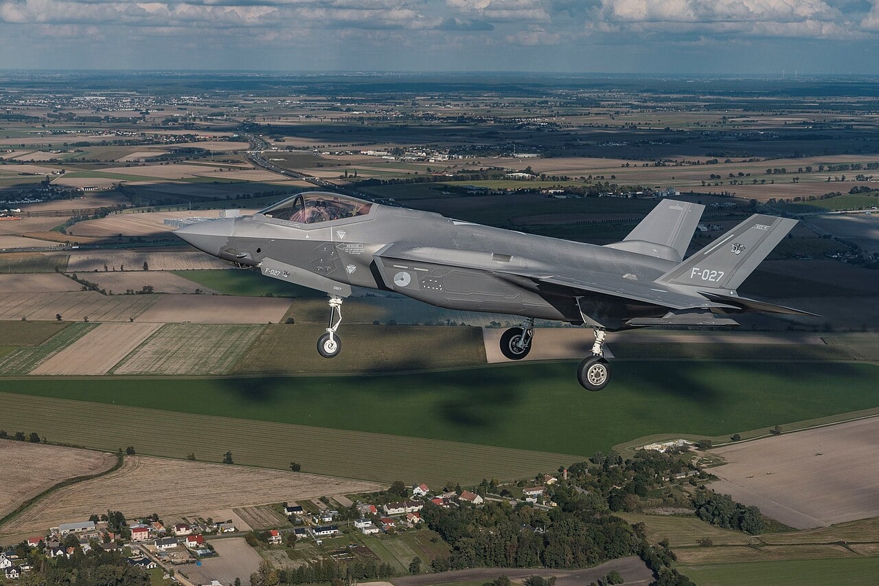 Royal Netherlands Air and Space Force F-35A F-027 flying over Polish farmland