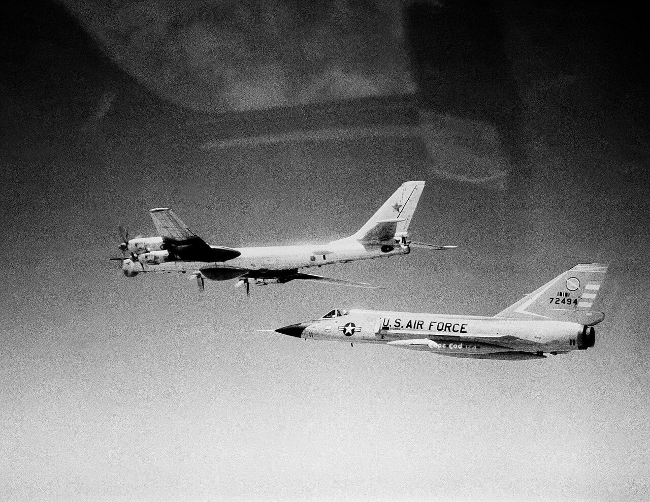 Convair F-106A Delta Dart 57-2494 of the 102nd Fighter Interceptor Wing flying alongside a Soviet Tu-95 Bear D bomber off Cape Cod in 1982