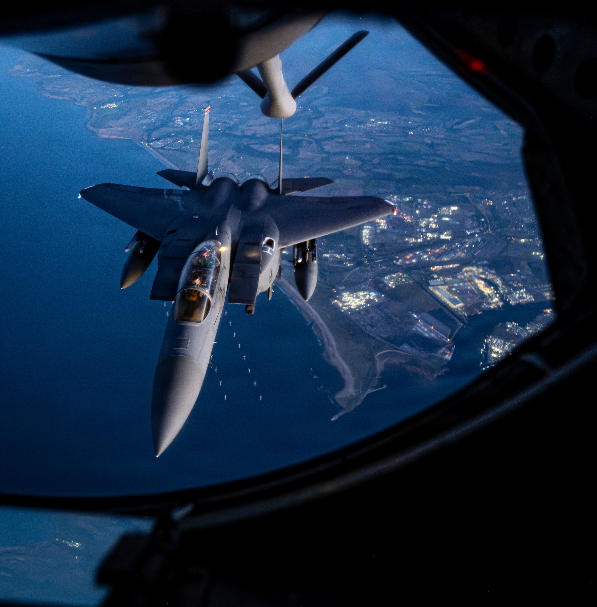 A US Air Force F-15E Strike Eagle approaches a KC-135 Stratotanker over Scotland during exercise Atlantic Thunder 2026