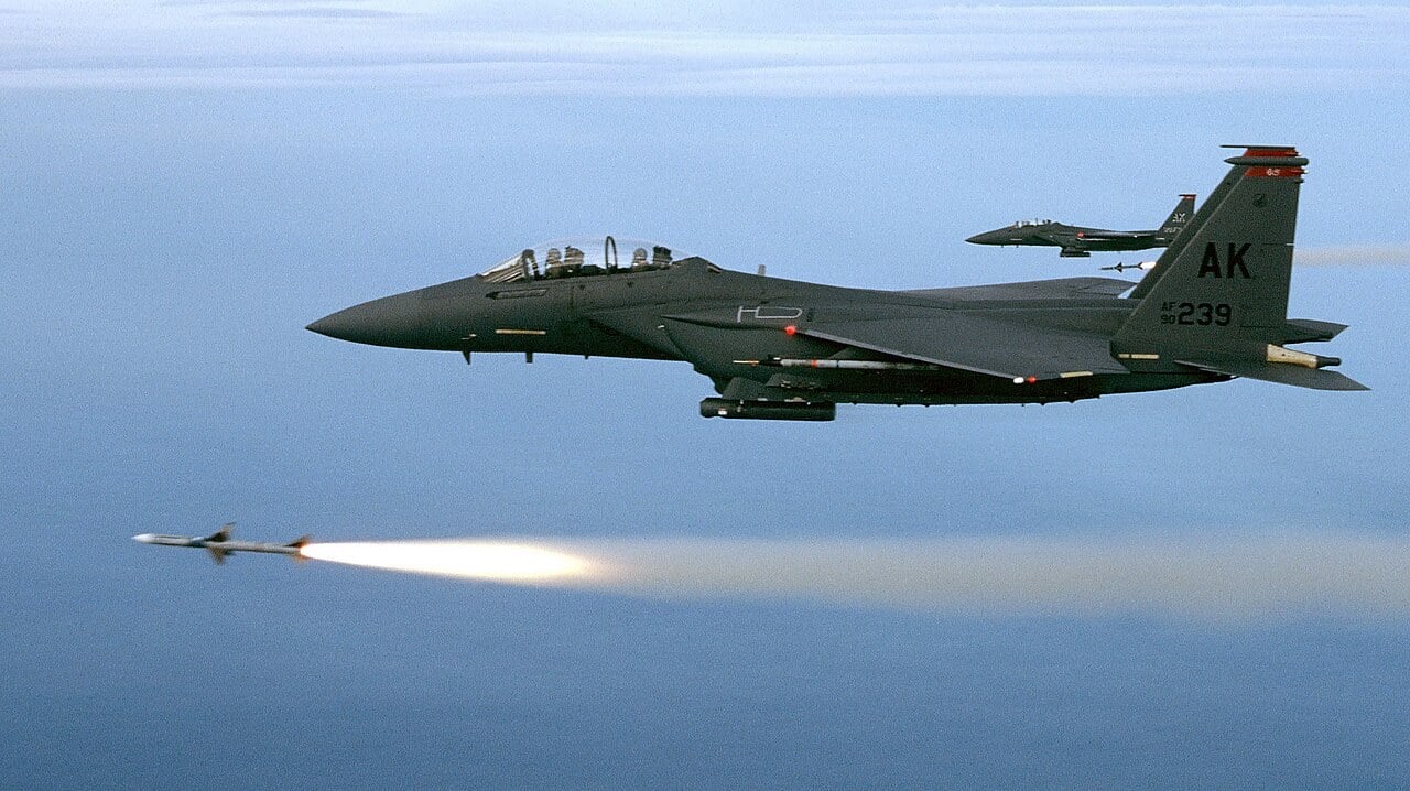 Two US Air Force F-15E Strike Eagles of the 90th Fighter Squadron firing AIM-7M Sparrow missiles over the Gulf of Mexico