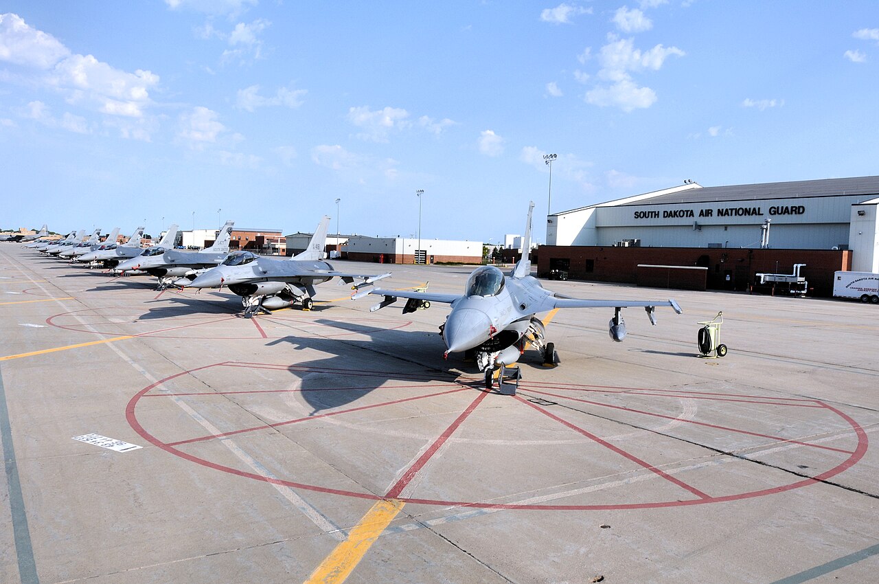 Row of grey USAF F-16C Block 40 fighters of the 114th Fighter Wing on the flight line at Joe Foss Field, South Dakota