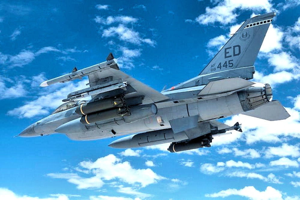 F-16C 88-0445 of the 416th Flight Test Squadron carrying weapons over China Lake