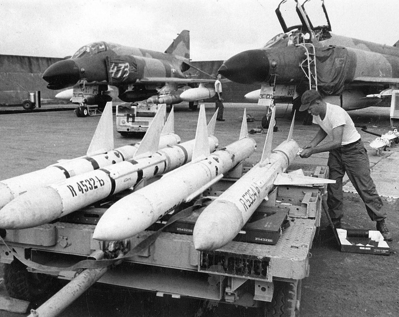 US Air Force ground crew preparing AIM-7E Sparrow missiles for loading on F-4C Phantom II fighters in South Vietnam in 1967