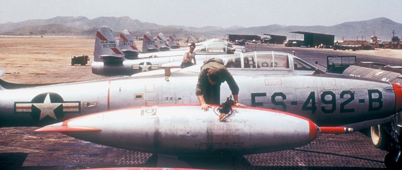 A USAF F-84E Thunderjet of the 136th Fighter-Bomber Group on a ramp in Korea in 1952, with a refuelling probe on its tip tank