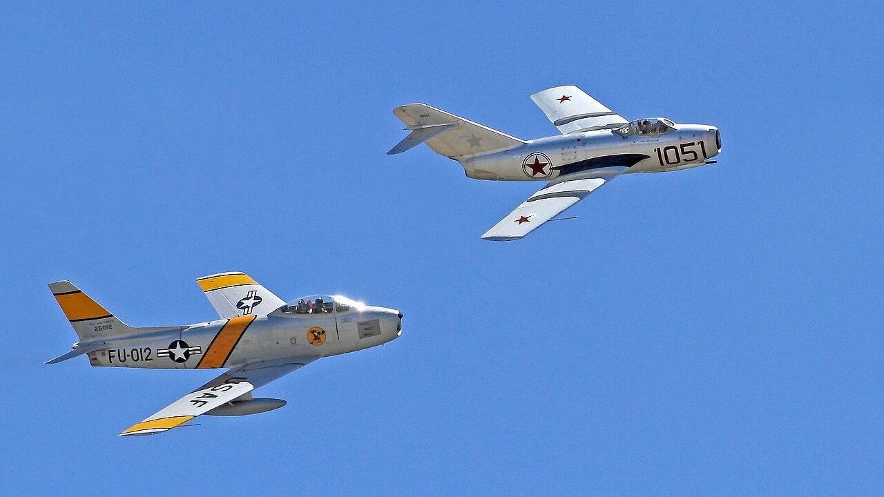 F-86 Sabre and MiG-15 flying together A North American F-86 Sabre and a Mikoyan-Gurevich MiG-15 flying together at the 2014 Chino Airshow, both showing their 35-degree swept wings
