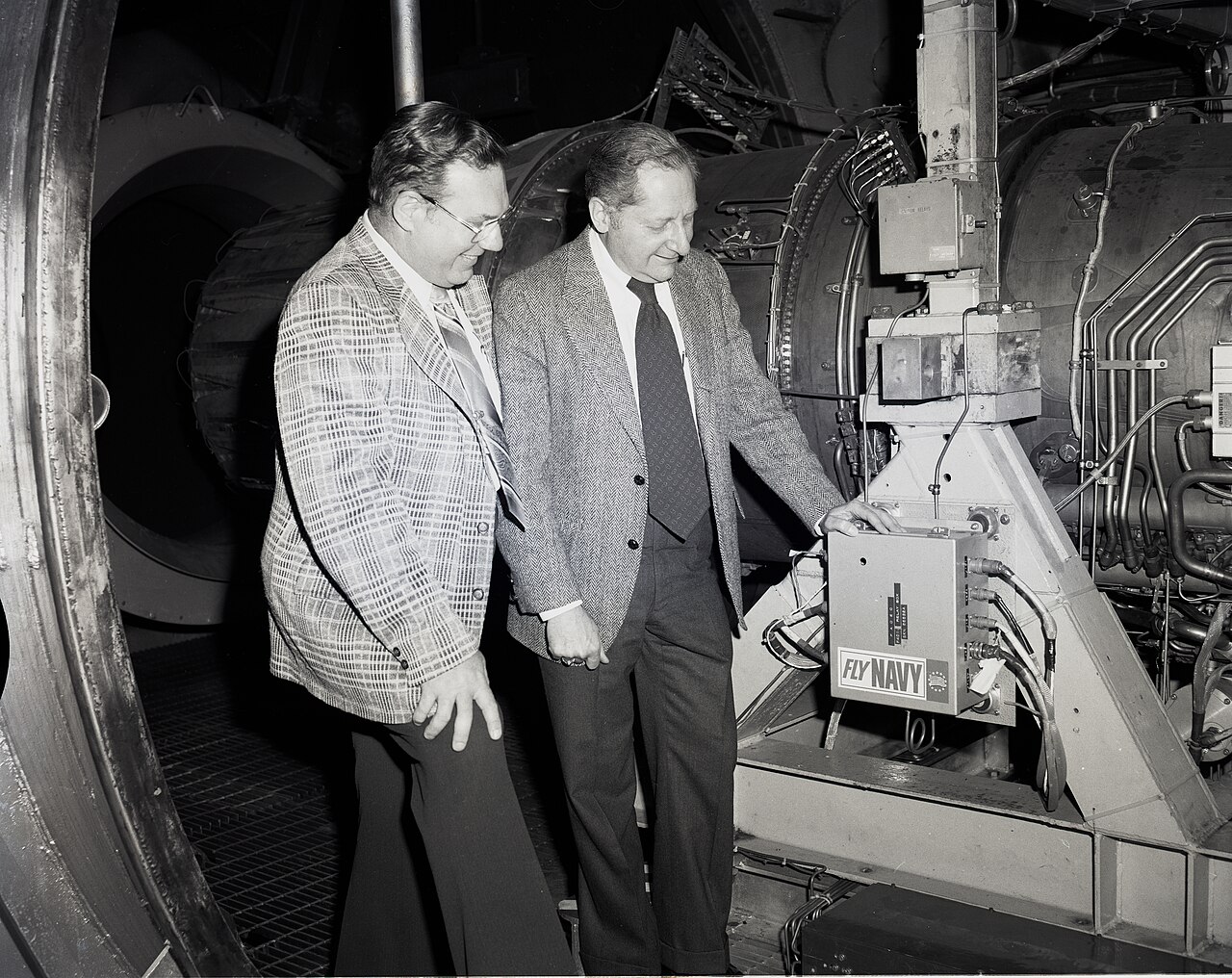 Engineers inspect an early FADEC unit on a U.S. Navy jet engine in 1979