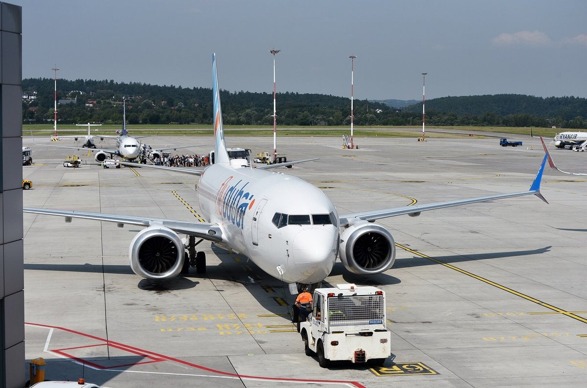 flydubai Boeing 737-8 MAX A6-FMG being towed at Krakow airport in 2024
