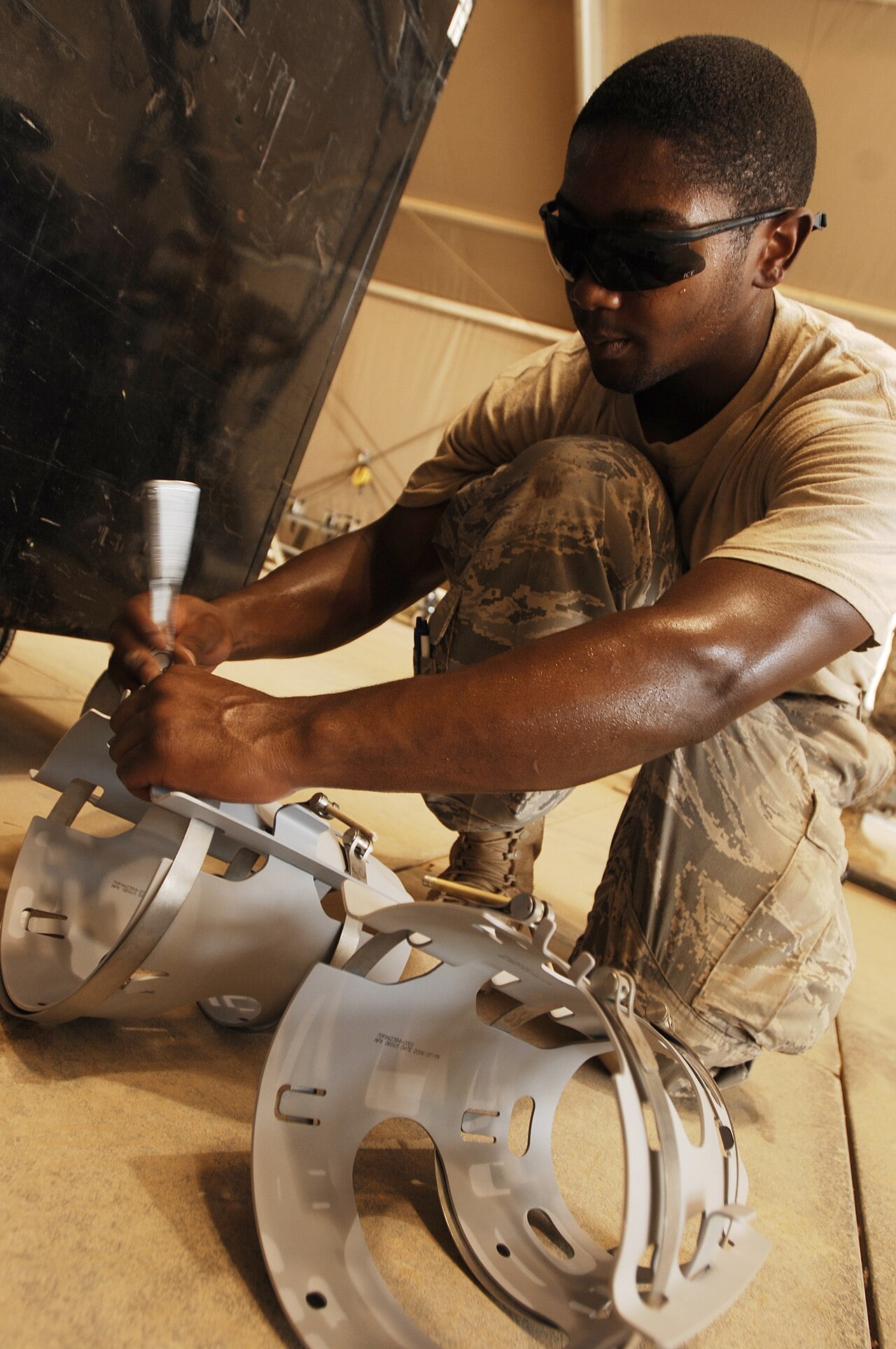 Airman assembling a JDAM strake kit