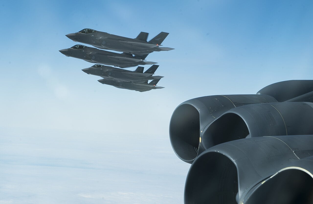 Royal Norwegian Air Force F-35As in formation with a Minot B-52H in 2020