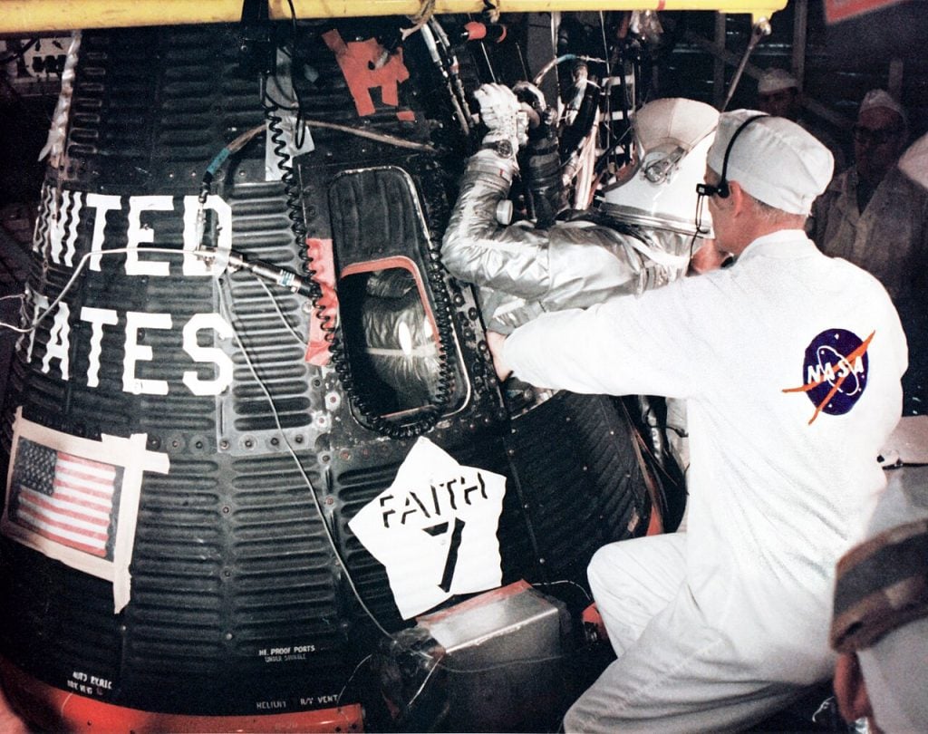 Gordon Cooper climbing into the Faith 7 Mercury spacecraft before launch