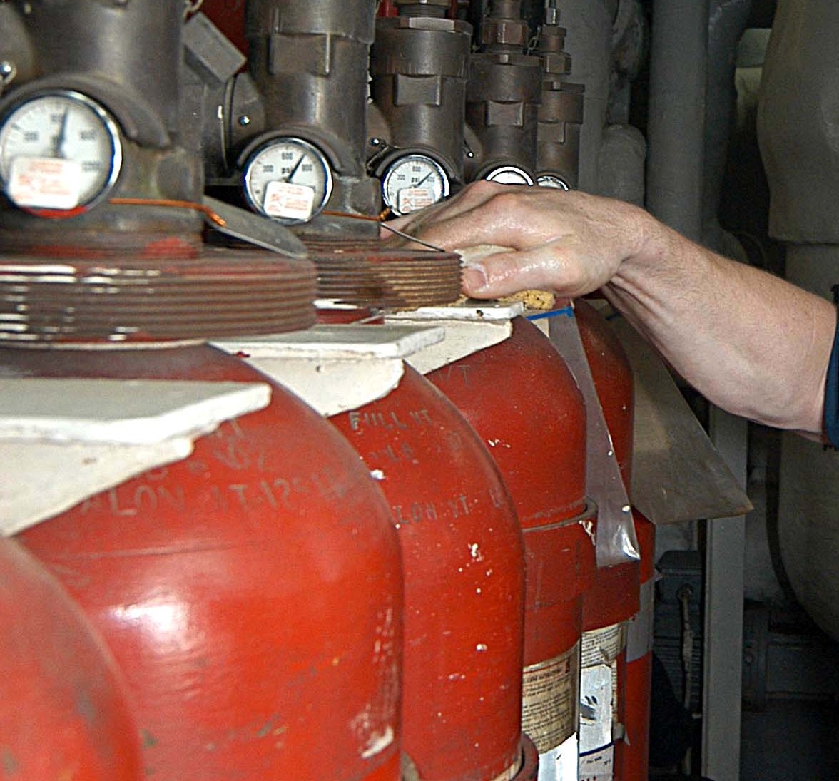 Halon 1301 fire suppression cylinders in a ship machinery space