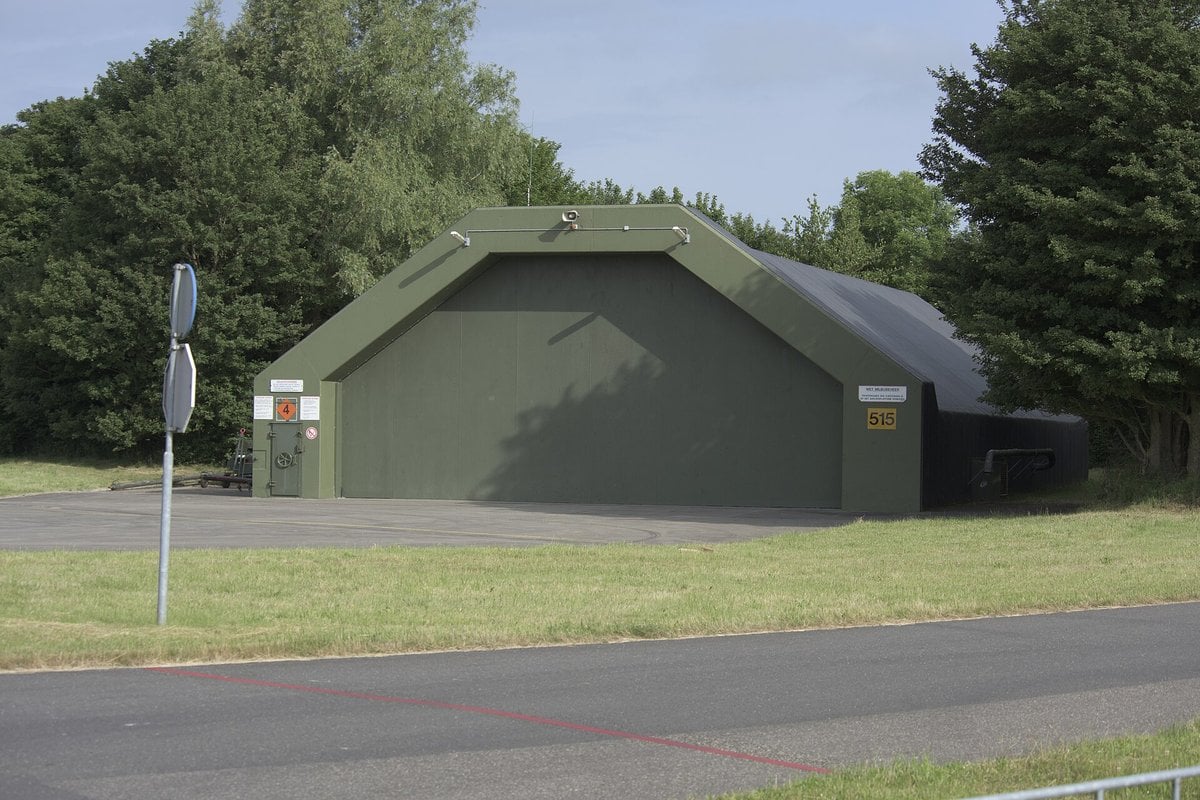 Green-painted hardened aircraft shelter with closed blast doors at Leeuwarden Air Base in the Netherlands
