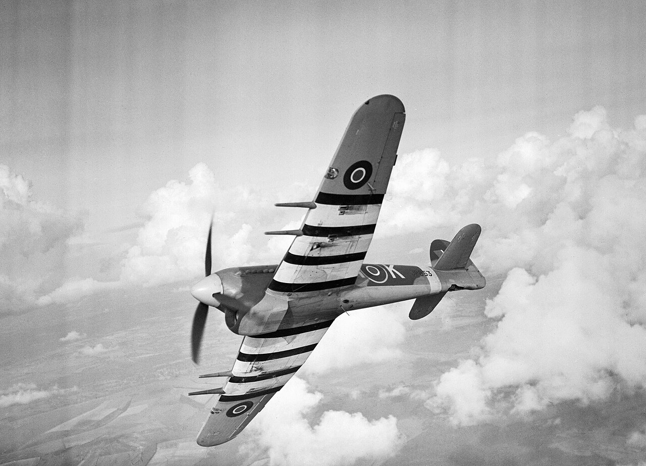 Hawker Typhoon Mk IB JP853 of No. 486 Squadron in flight, October 1943 Hawker Typhoon Mk IB JP853 SA-K of No. 486 Squadron RAF banking in flight with black and white identification stripes under the wings