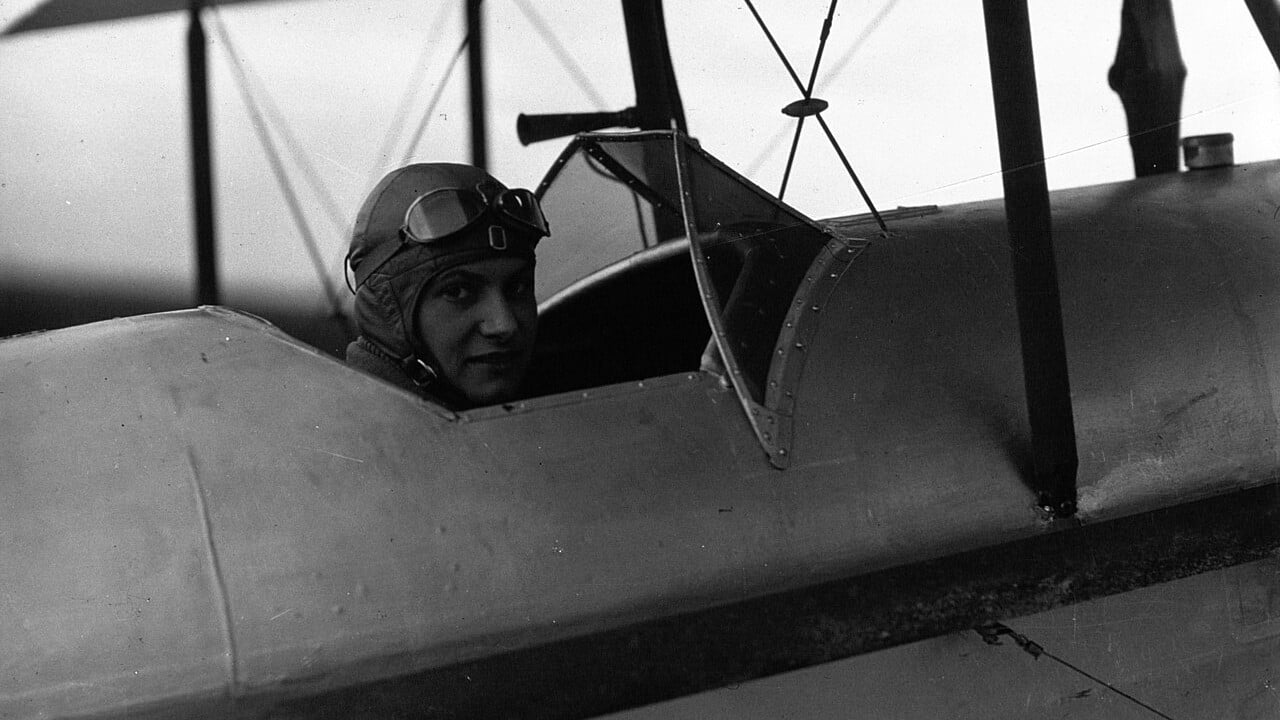 Hélène Boucher in the cockpit at Le Bourget, January 1933 French aviator Hélène Boucher in leather flying helmet and goggles in the cockpit of her biplane at Le Bourget in 1933
