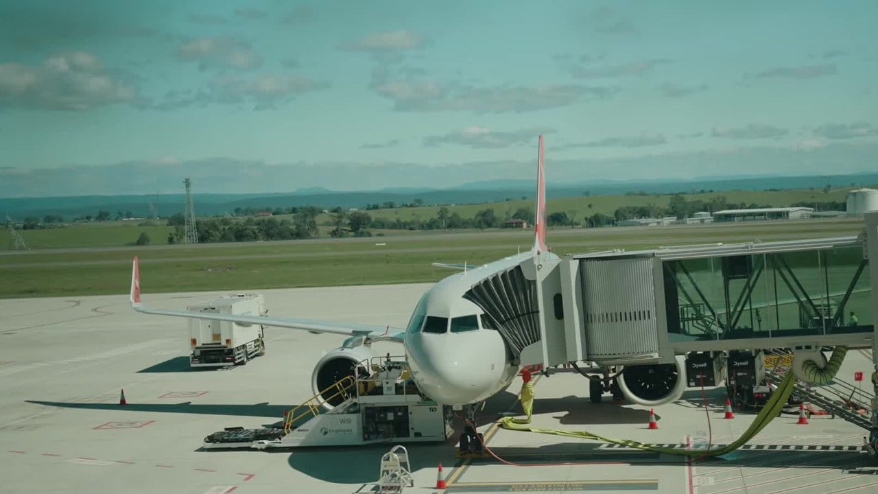 A Jetstar Airbus A320 parked at an aerobridge at Western Sydney International Airport, in a still from the airport&rsquo;s opening-day video