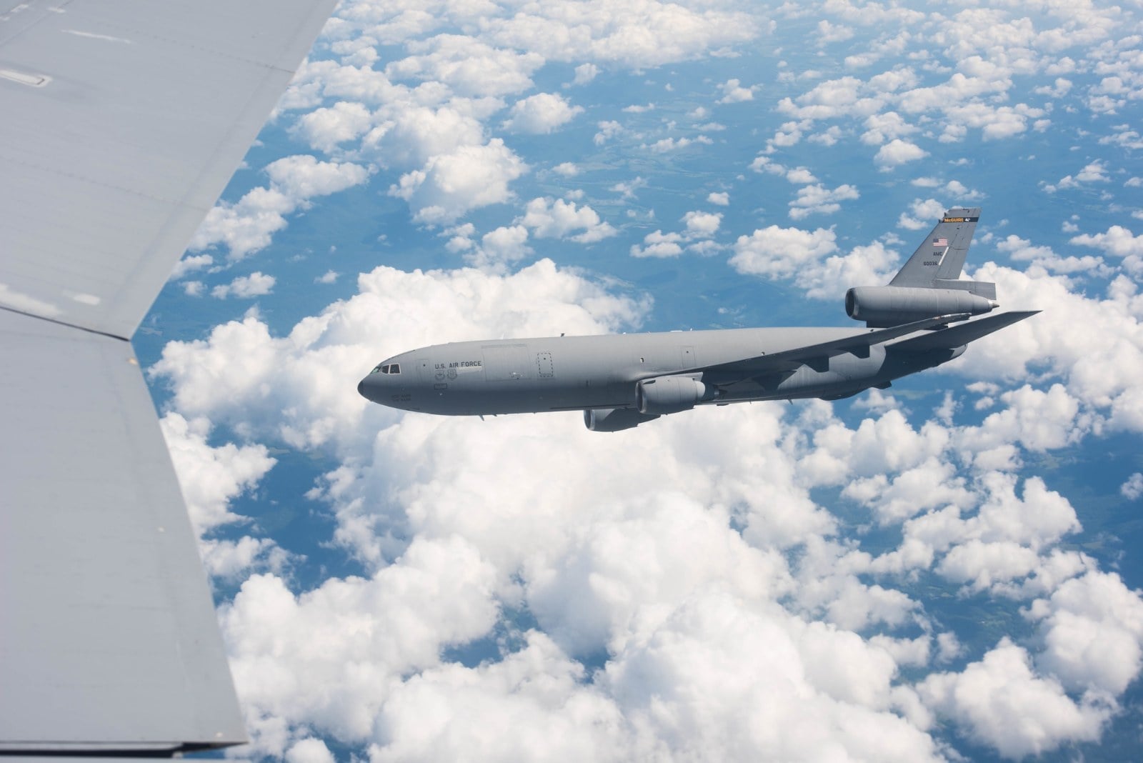 U.S. Air Force KC-10A Extender 86-0036 in flight above the clouds on its retirement flight in July 2020