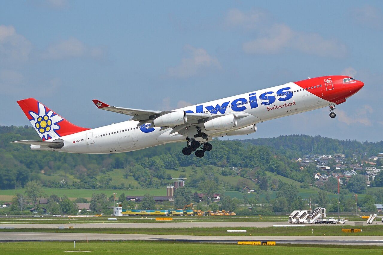 Edelweiss Airbus A340-300 HB-JMF lifting off from Zurich with its landing gear still extended