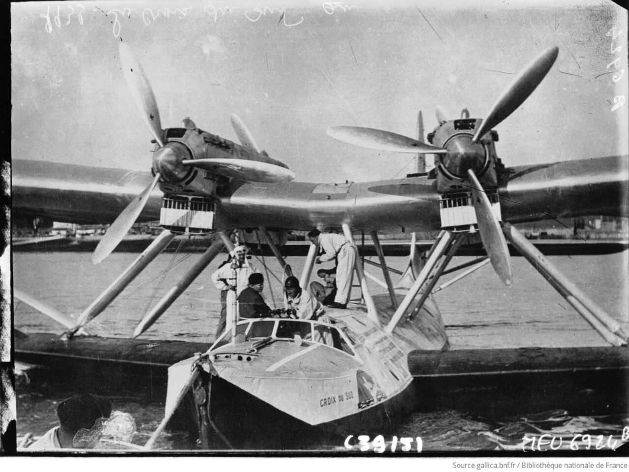 Latécoère 300 flying boat Croix-du-Sud moored on the water with crew on the hull and its name on the bow