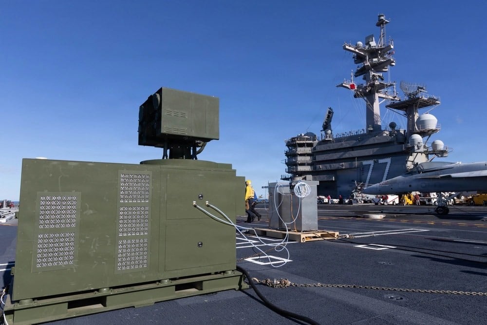 AeroVironment palletized LOCUST laser weapon system on the flight deck of USS George H.W. Bush