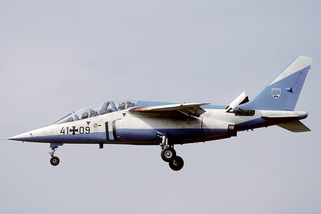 A German Air Force Alpha Jet A with its pointed nose on approach with gear down