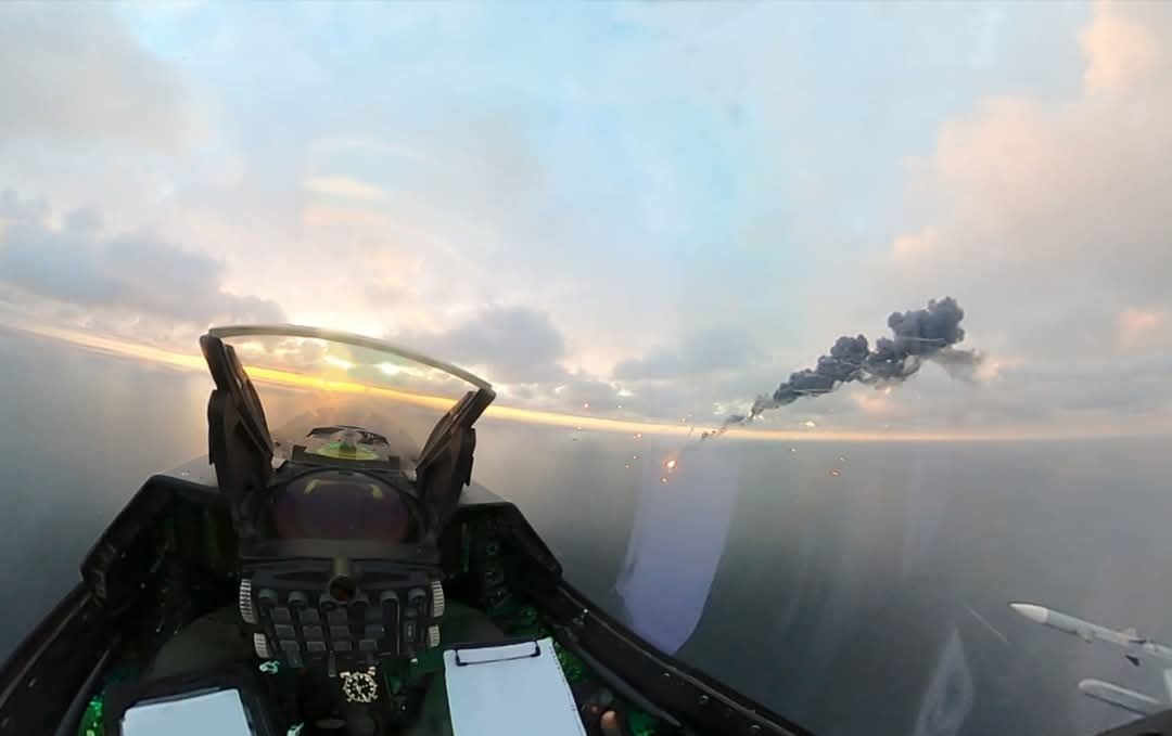 A drone burns and trails black smoke over the Black Sea, seen from the cockpit of a Romanian F-16, 17 October 2026