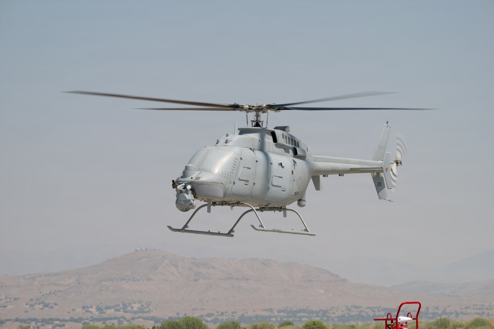 MQ-8C Fire Scout with its nose sensor turret hovering at Dugway Proving Ground