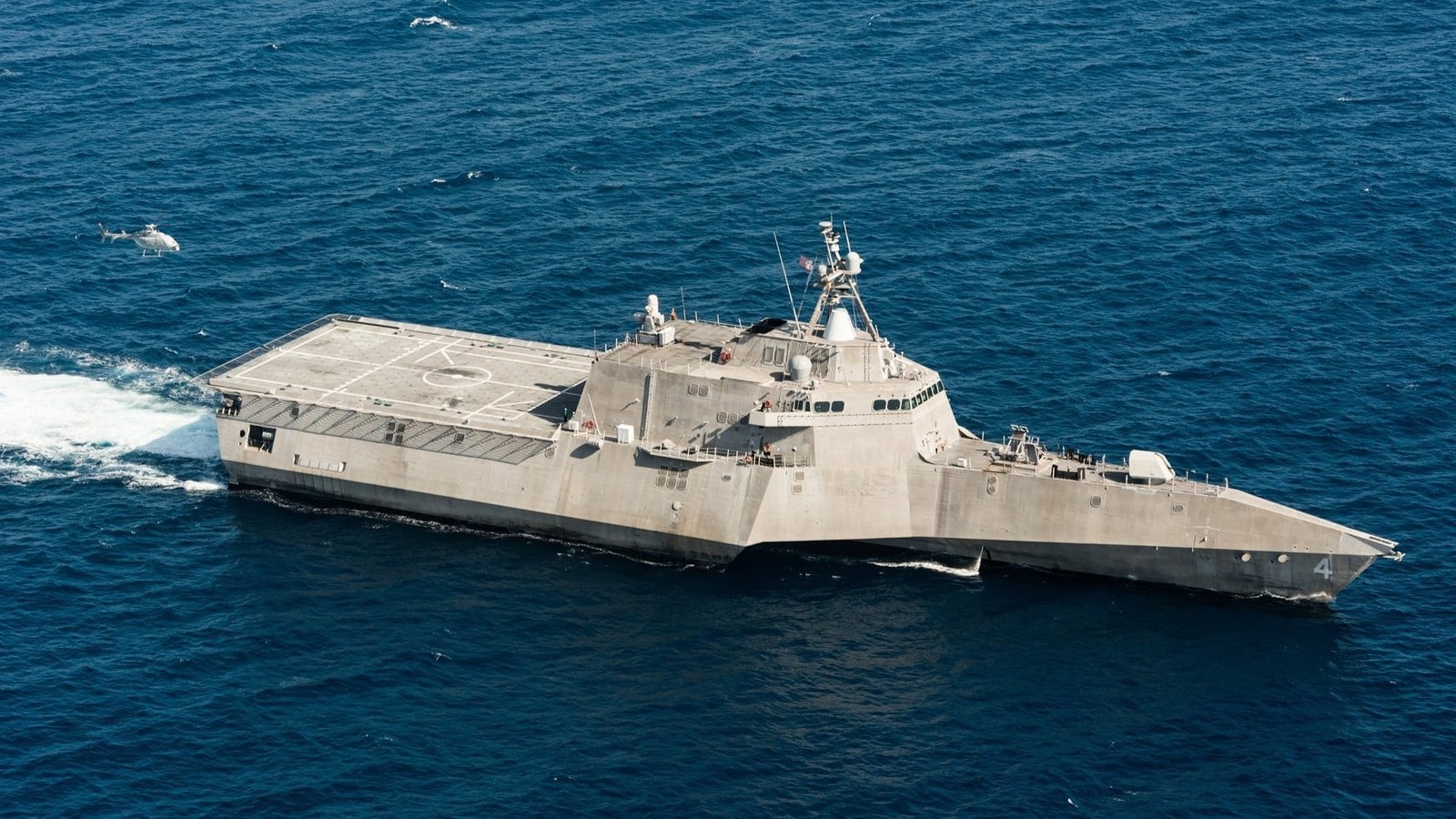 MQ-8C Fire Scout flying alongside the Littoral Combat Ship USS Coronado
