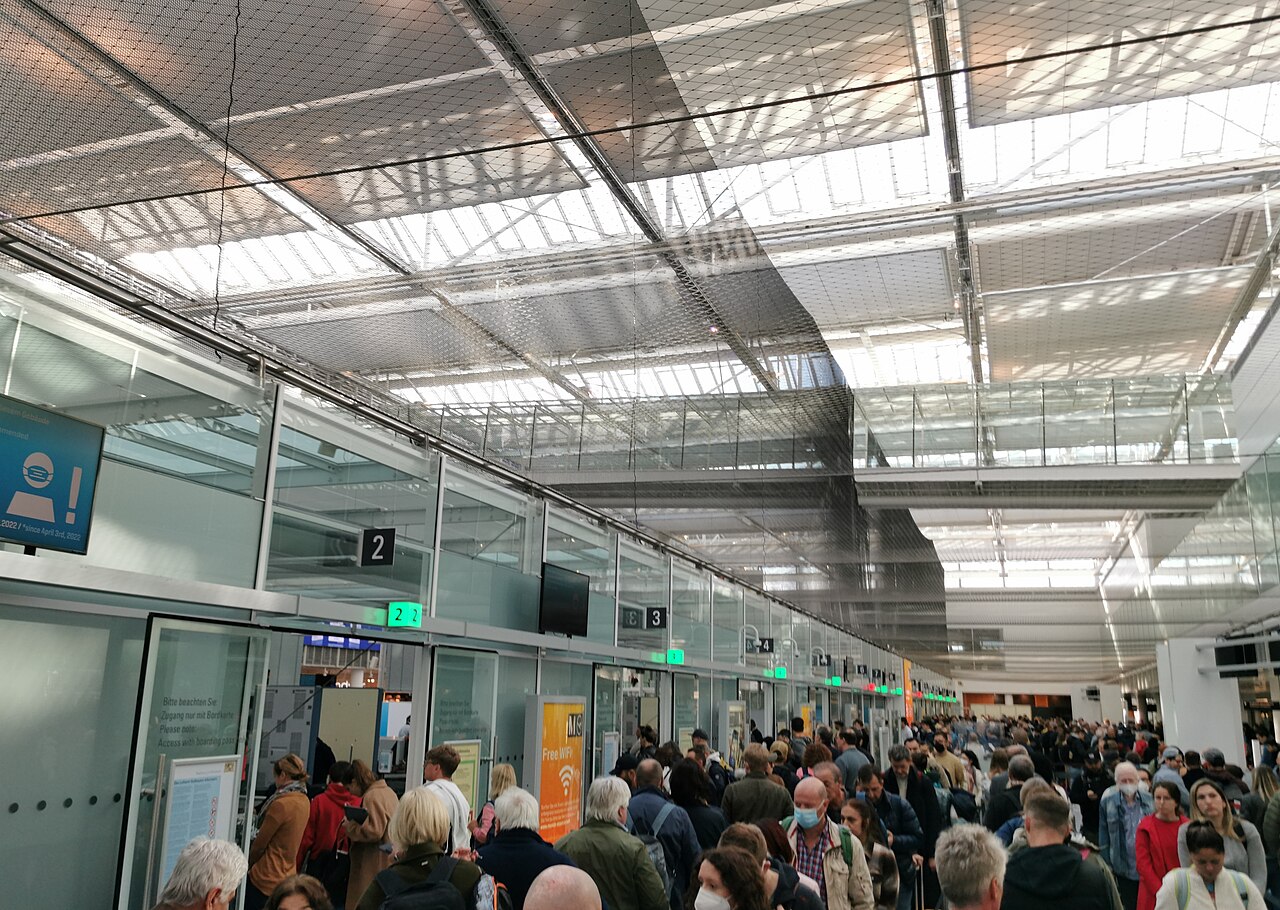 Passengers queueing at a security checkpoint in Terminal 2 of Munich Airport
