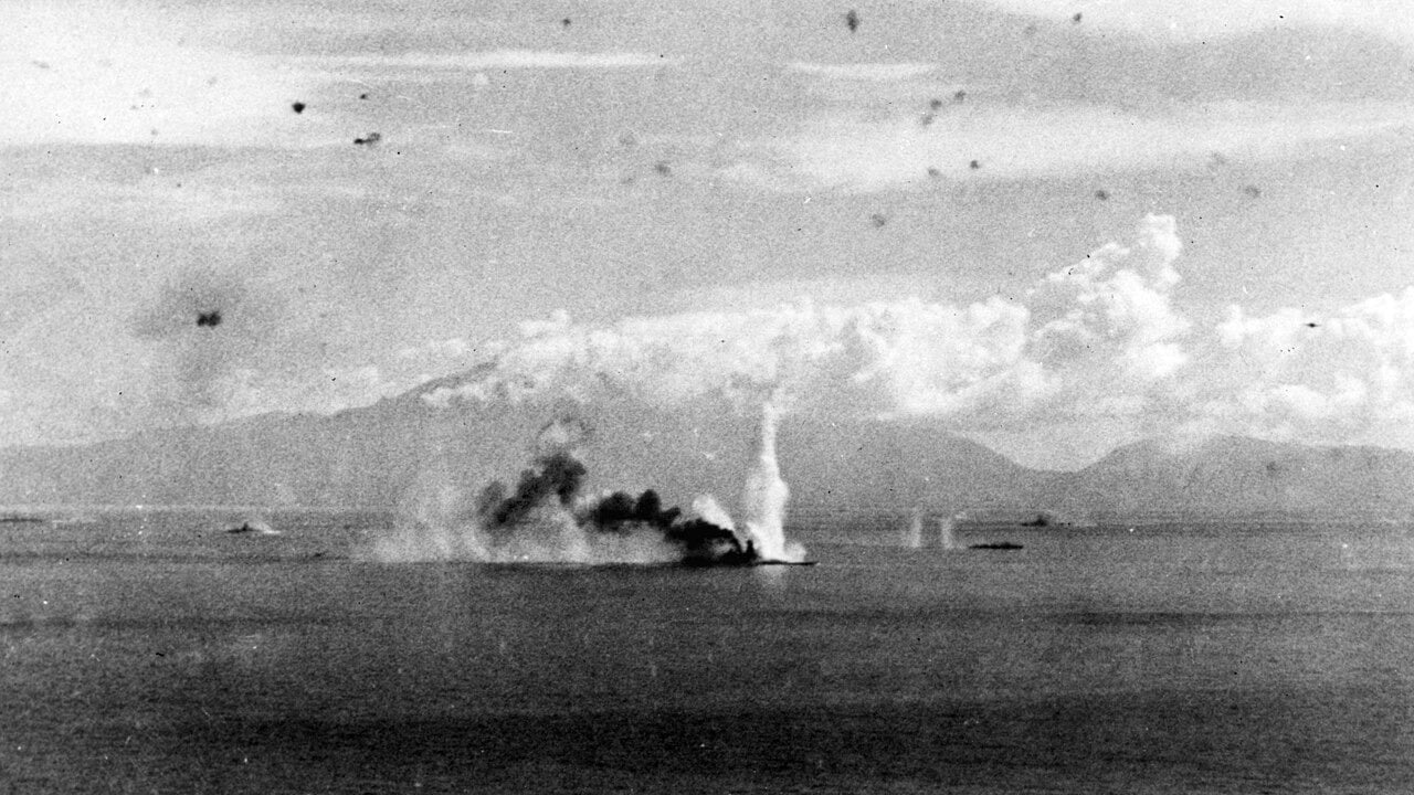 Musashi hit in the Sibuyan Sea, 24 October 1944 Japanese battleship Musashi smoking after being hit by US carrier aircraft in the Sibuyan Sea, 24 October 1944