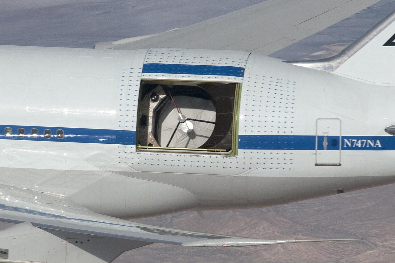 NASA SOFIA Boeing 747SP flying observatory with telescope door open