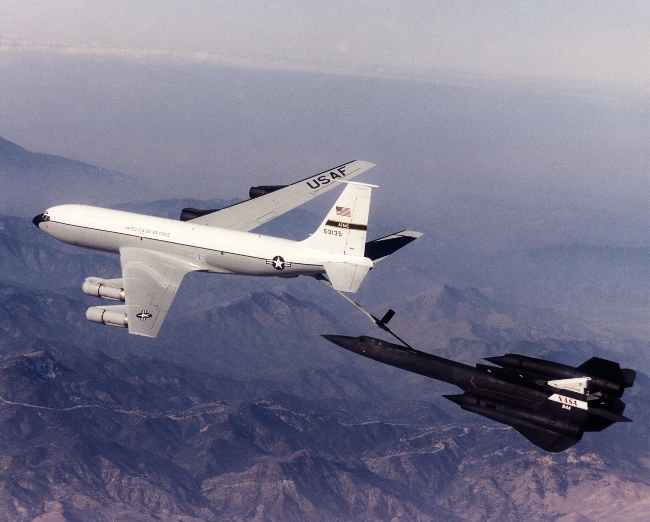 NASA SR-71 Blackbird refuelling from a USAF KC-135 tanker over the Mojave Desert
