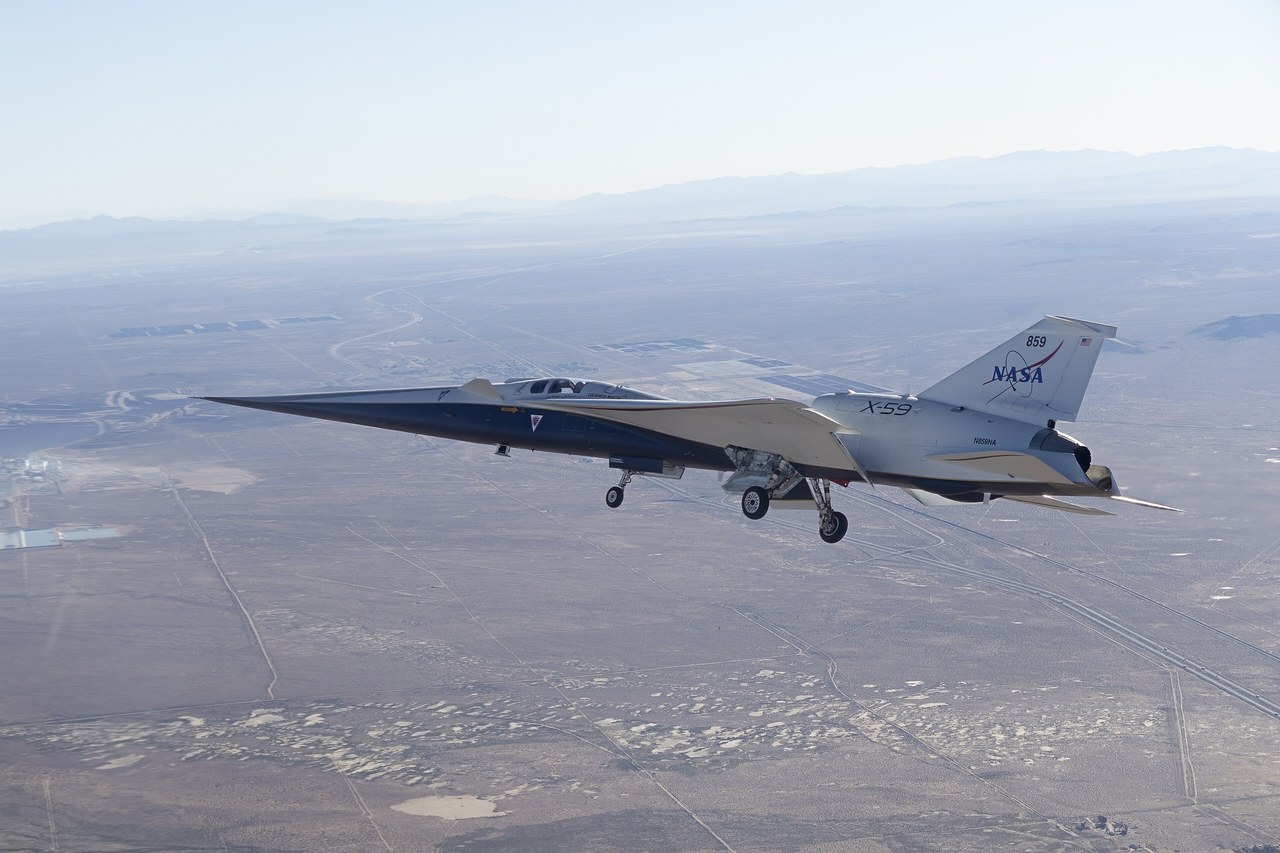 NASA X-59 quiet supersonic research aircraft in flight above the Mojave Desert