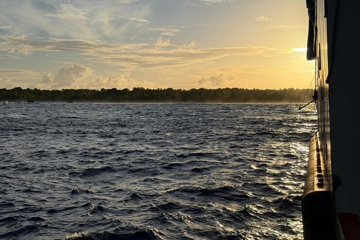 Sunrise over Nikumaroro from the expedition vessel