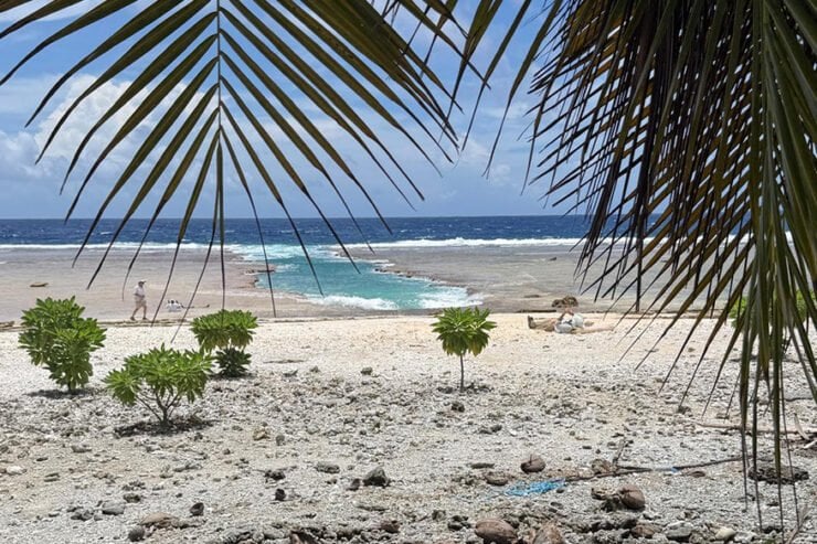 Expedition members heading to Nikumaroro island by transport boat