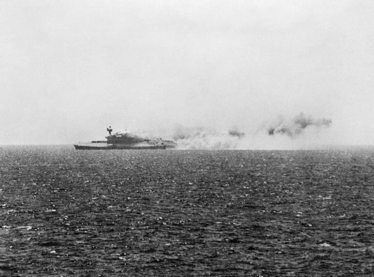 Aircraft carrier HMS Eagle listing heavily as she sinks after being torpedoed by U-73 on 11 August 1942