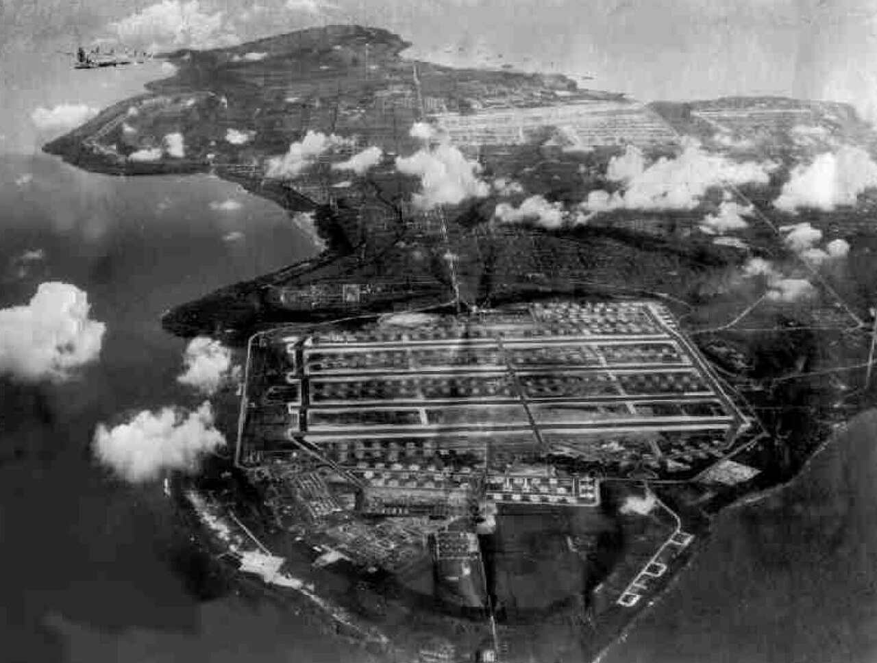 Aerial view of Tinian in 1945 showing the vast North Field with its parallel runways in the foreground and West Field beyond