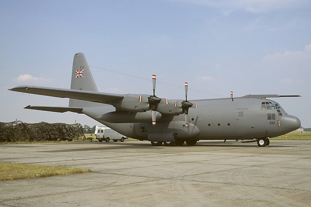 A grey Royal Air Force Lockheed C-130K Hercules C1P transport parked on an airfield apron
