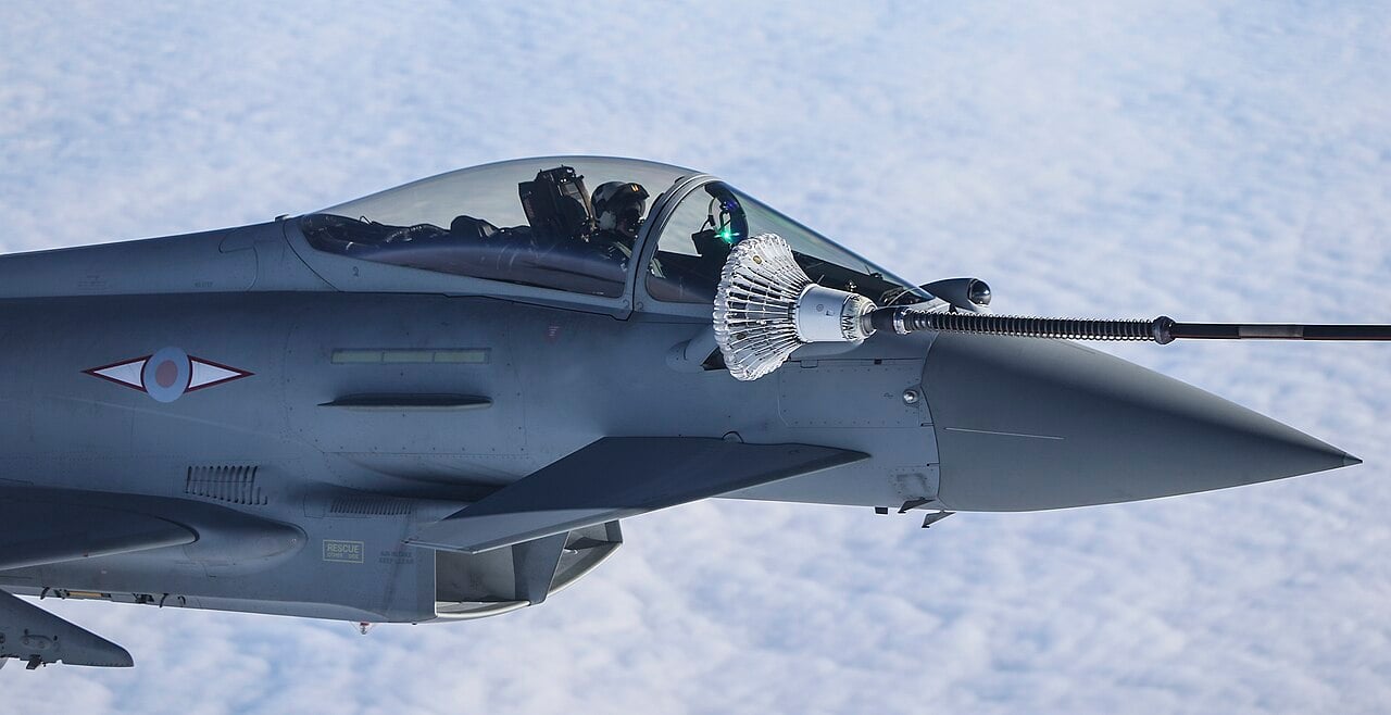 RAF Typhoon FGR4 taking fuel from the hose and drogue of an RAF Voyager tanker above cloud