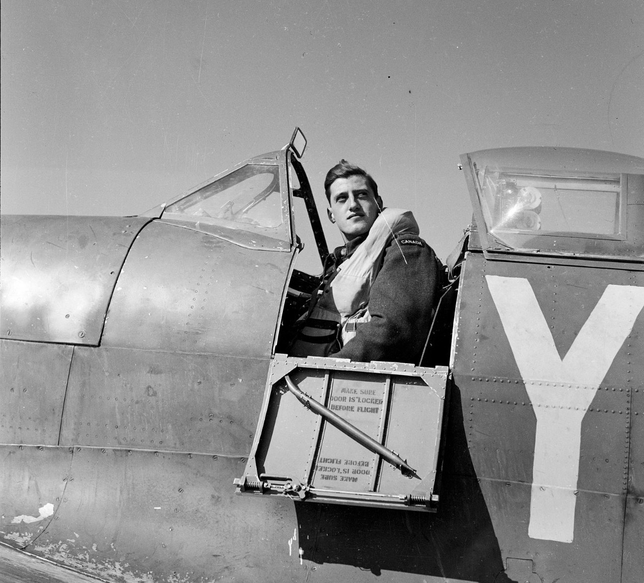 RCAF pilot in his Spitfire after a Dieppe sortie