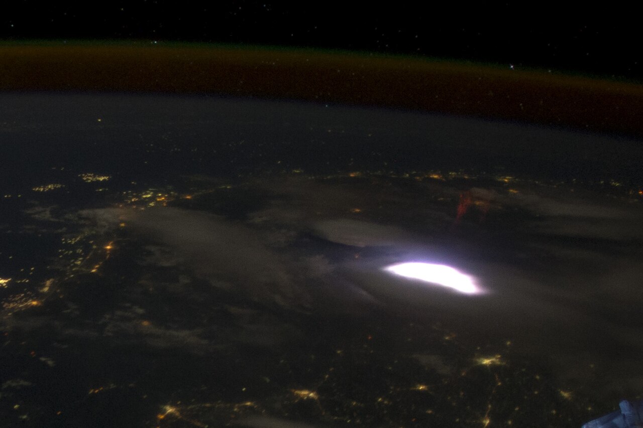 A red sprite above a lightning flash, photographed from the ISS in 2012