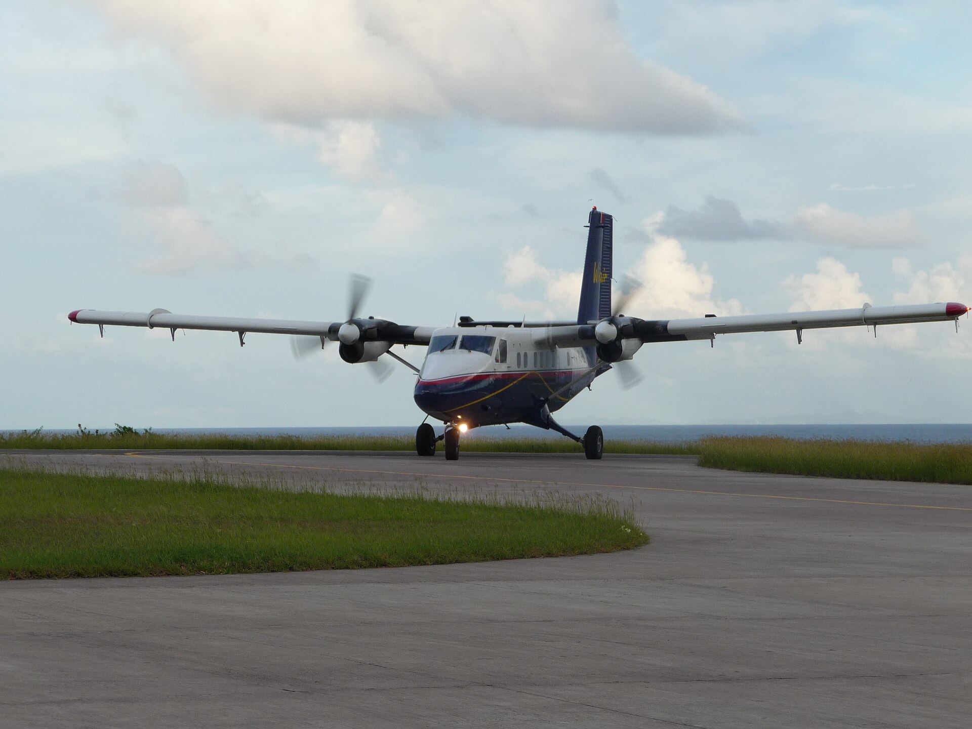 A DHC-6 Twin Otter at Saba with the Caribbean behind