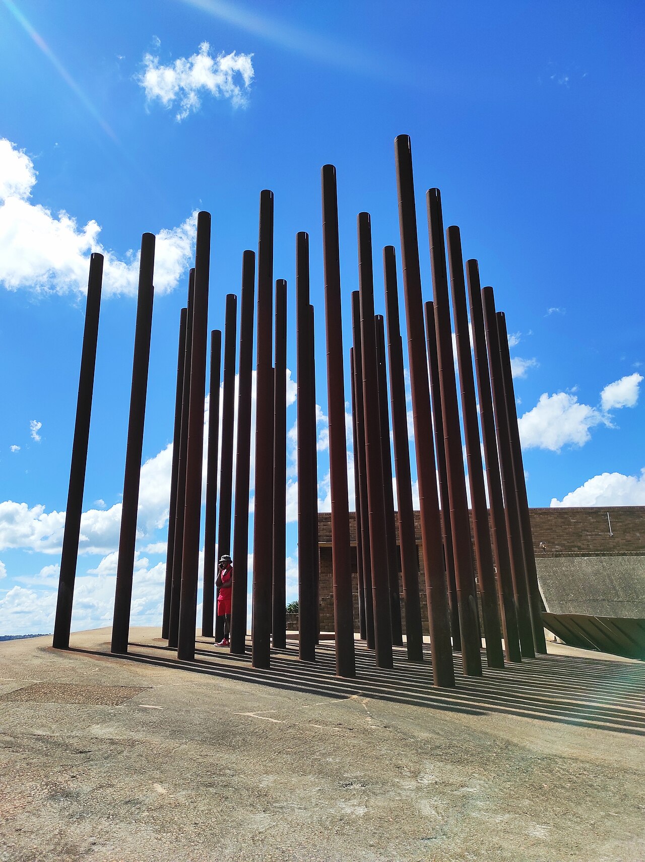 Steel pipes of the Samora Machel Monument at Mbuzini against a blue sky