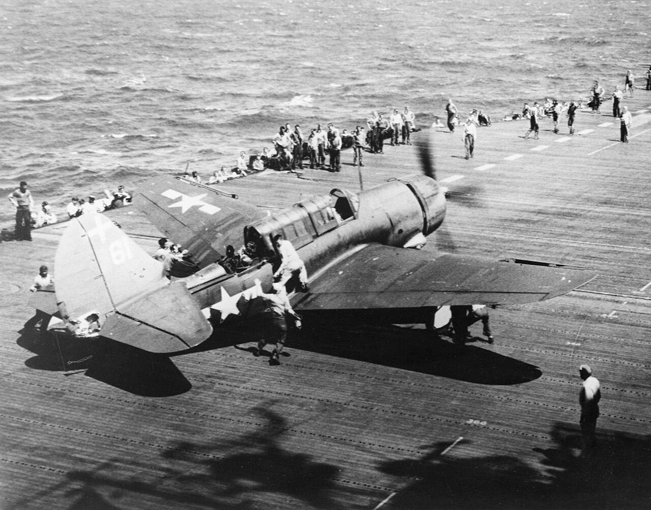 A US Navy SB2C-3 Helldiver of Bombing Squadron 18 being moved on the deck of USS Intrepid during the Battle of Leyte Gulf