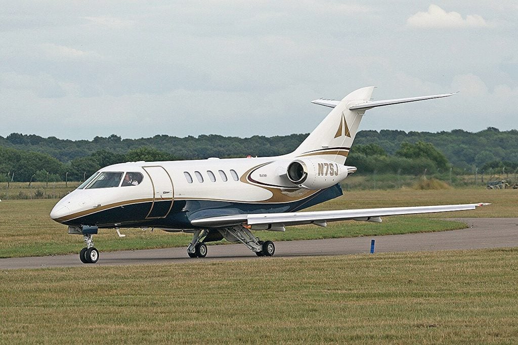 An SJ30-2 light business jet on the ground