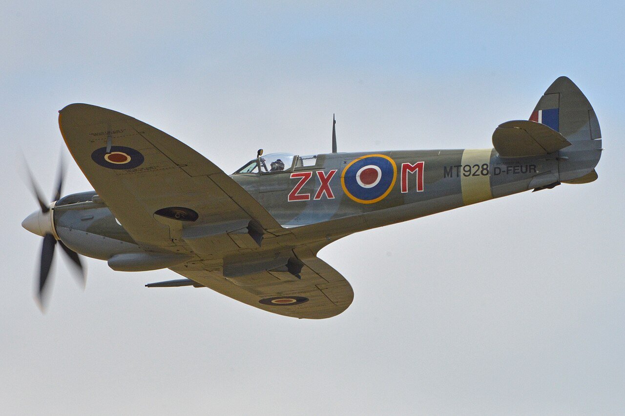 Spitfire Mk VIII MV154, painted as MT928 ZX-M, in flight at Duxford in July 2015