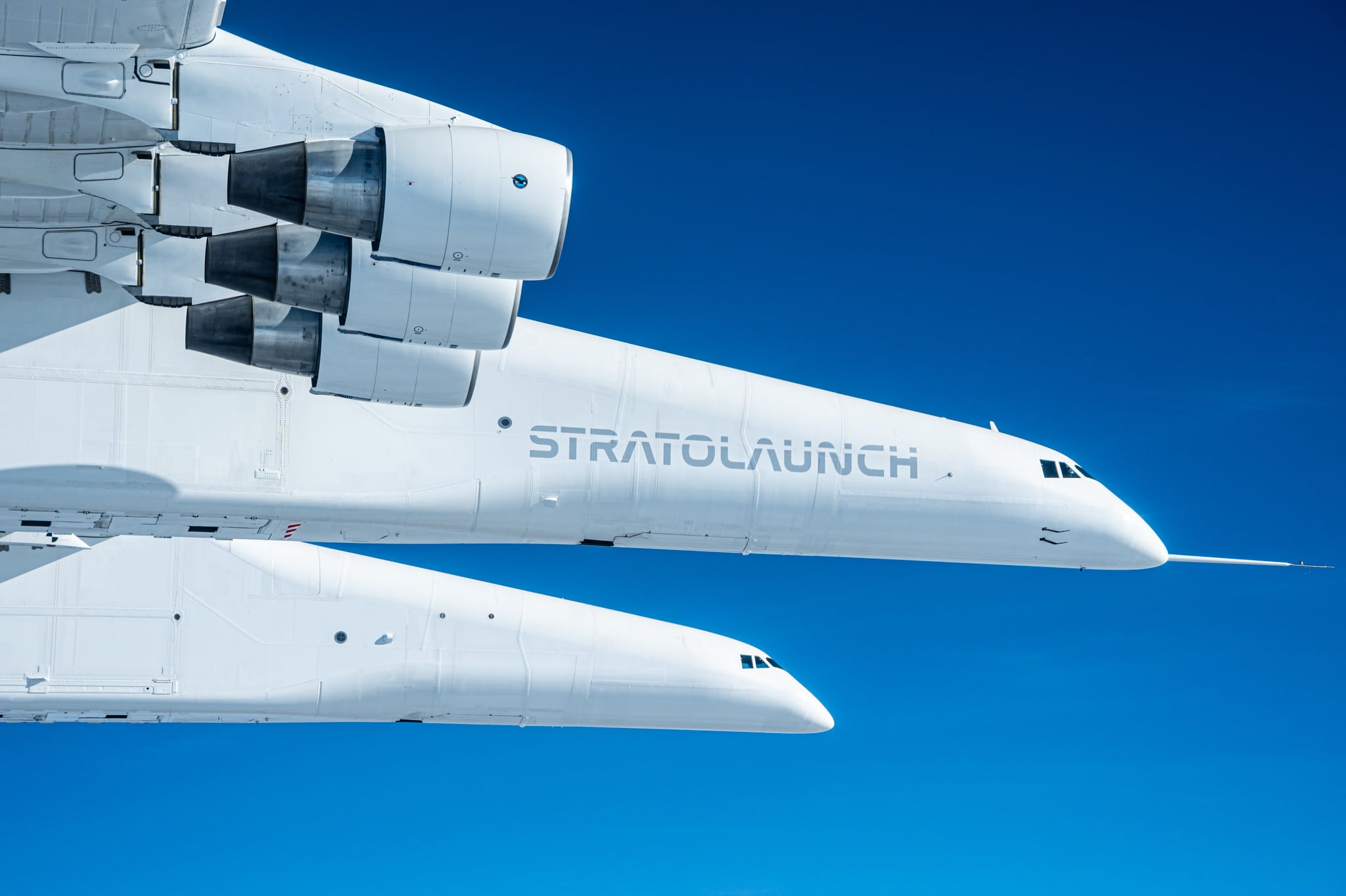Stratolaunch Roc in flight Stratolaunch Roc twin fuselages and PW4056 engines in flight, December 2024