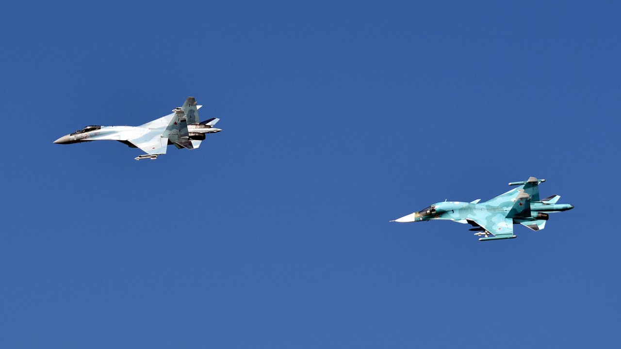 Russian Su-34 and Su-35S in formation A Russian Aerospace Forces Su-34 fighter-bomber and Su-35S fighter flying together